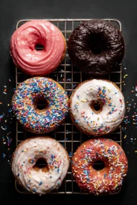 Three delectable donut frosting flavor varieties showcased on donuts