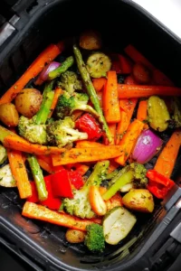 Colorful air fryer vegetables served in a bowl, showcasing healthy meal options.