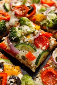 Homemade cold veggie pizza appetizer topped with fresh vegetables