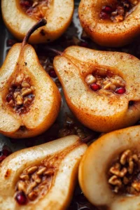 Delicious easy maple baked pears served on a plate with caramel sauce.