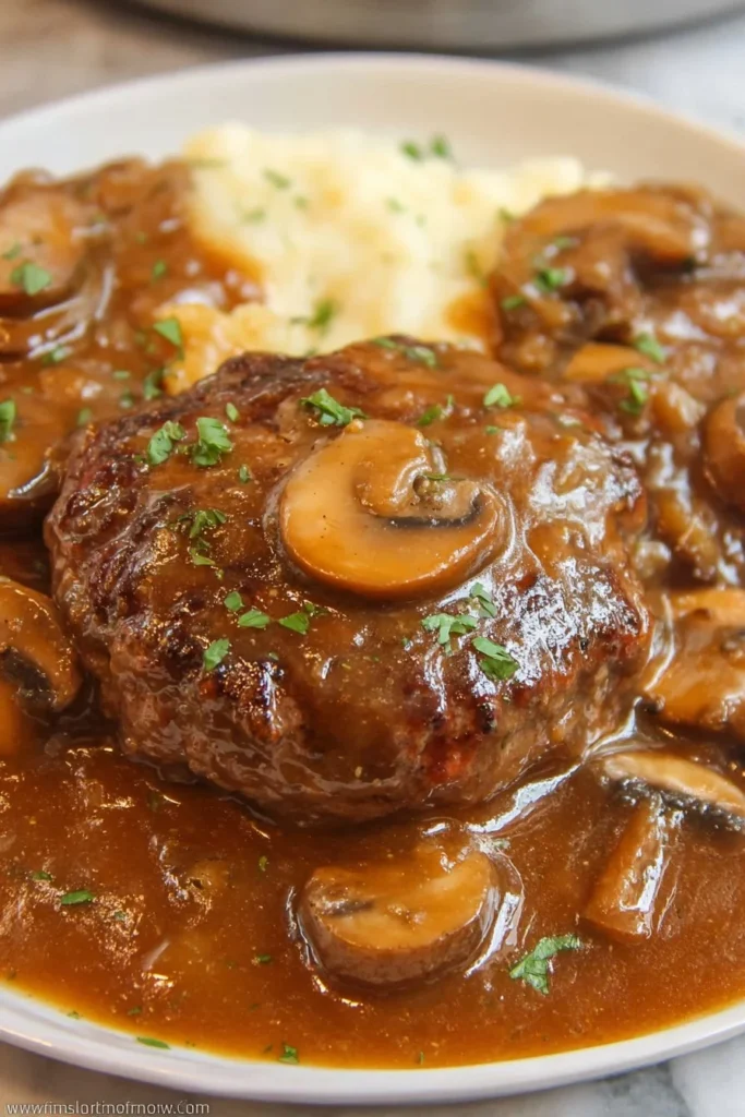 Easy Salisbury steak with mushroom gravy served on a plate