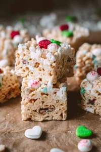Delicious holiday-themed Rice Krispie Treats stacked on a festive plate