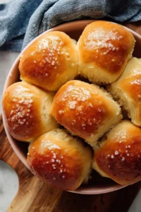 Freshly baked Honey Butter Rolls served on a plate