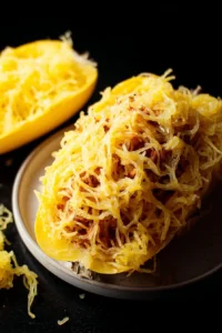 Plate of Million Dollar Spaghetti Squash Pasta garnished with fresh herbs