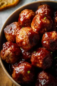 Delicious slow cooker BBQ meatballs served with sauce