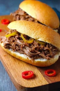Spicy Crock Pot Italian Beef served on a plate with fresh toppings