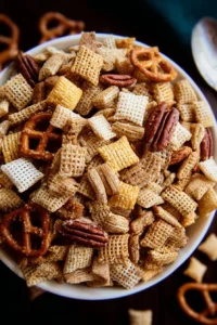 Delicious Sweet Holiday Chex Mix in a festive bowl, perfect for celebrations.