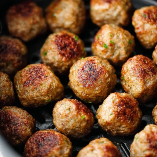 A plate of air fryer frozen meatballs, crispy and ready to serve.