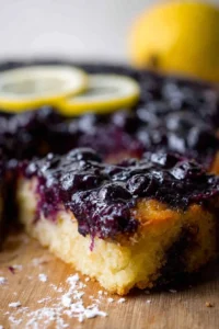 Blueberry lemon upside-down cake with fresh blueberries and lemon slices
