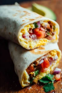 Delicious breakfast burritos filled with eggs, cheese, and fresh vegetables.