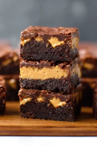 Delicious Buckeye Brownies topped with creamy peanut butter and chocolate
