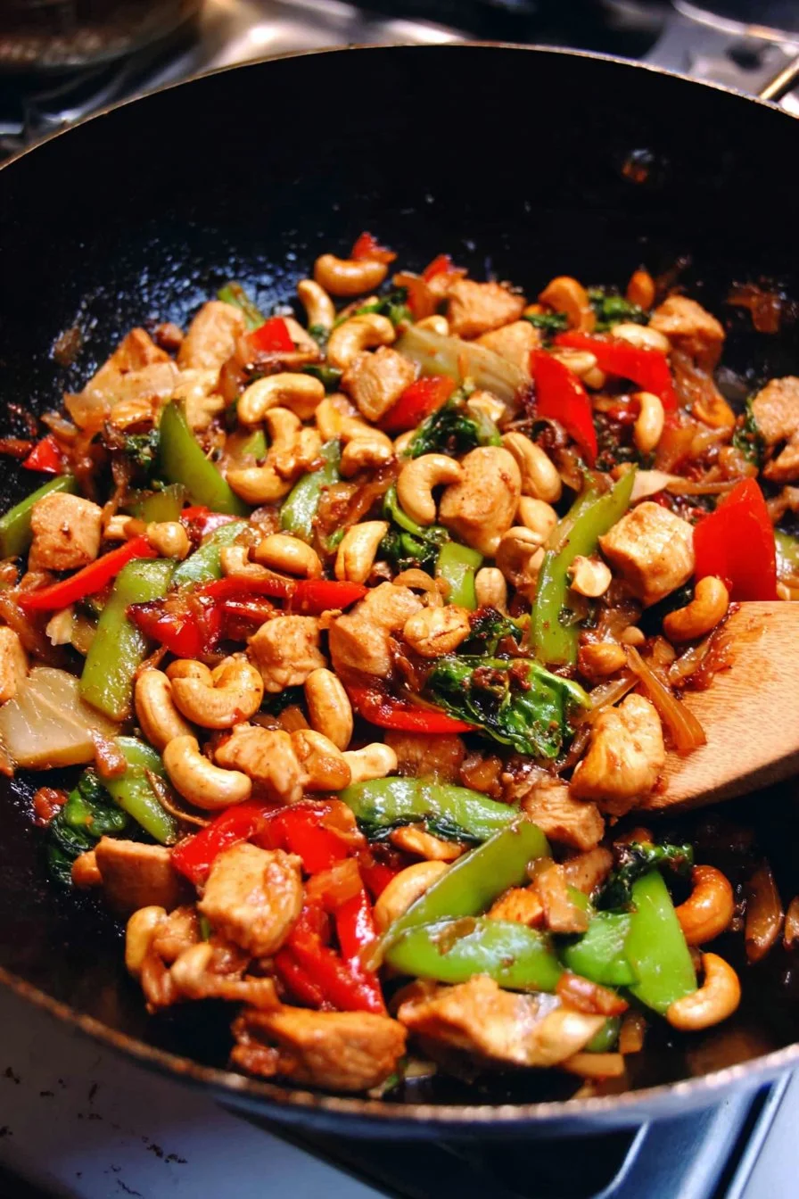 Delicious cashew chicken stir fry with colorful vegetables and cashews