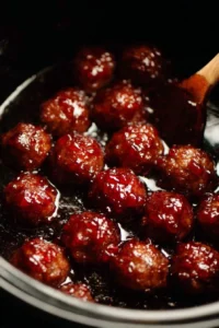 Easy grape jelly meatballs served on a platter for a flavorful appetizer.