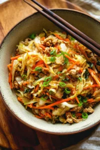 Delicious egg roll in a bowl dish with veggies and protein