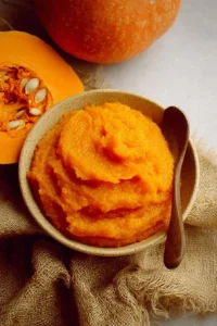 Bowl of homemade pumpkin puree made from fresh pumpkins
