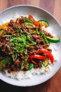 Korean Ground Beef Stir Fry with colorful vegetables in a skillet