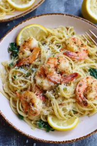 A plate of Lemon Garlic Parmesan Shrimp Pasta garnished with parsley.