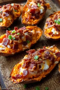 Delicious loaded sweet potato skins topped with cheese and herbs