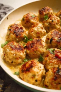 Marry Me Chicken Meatballs served with creamy sauce and herbs