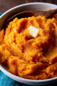 Bowl of creamy mashed sweet potatoes served as a side dish