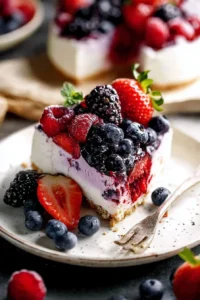 No Bake Very Berry Cheesecake topped with assorted fresh berries