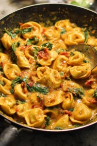 Delicious One-Pan Marry Me Tortellini served on a plate with fresh herbs