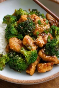 Delicious skillet sesame chicken served with broccoli for a hearty meal.
