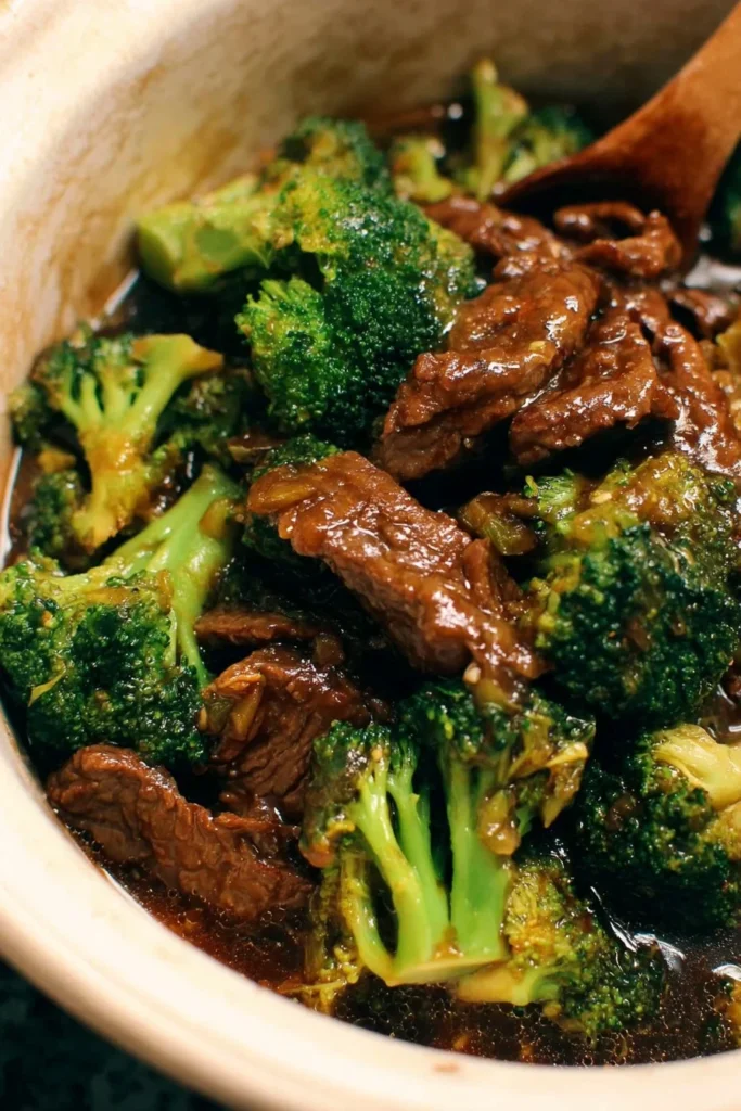 Slow Cooker Beef & Broccoli dish served in a bowl with rice