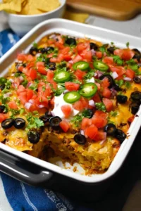 Delicious Taco Casserole topped with cheese and fresh ingredients