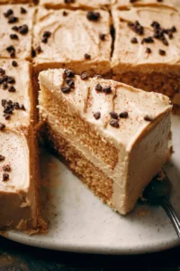 Toasted Vanilla Bean Latte Cake topped with whipped cream and coffee beans