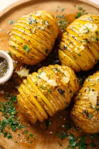 Air Fryer Garlic Butter Hasselback Potatoes garnished with herbs