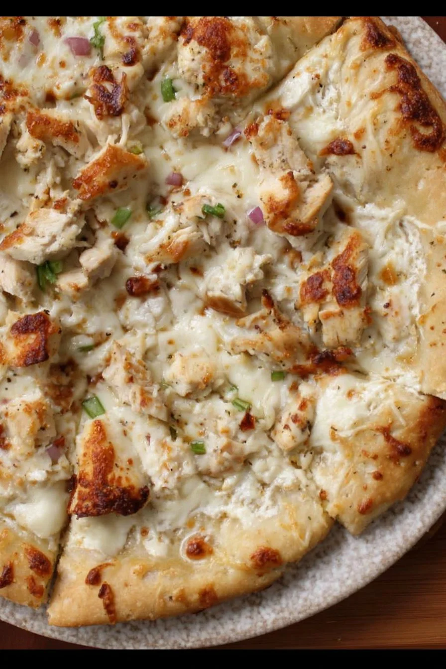 Delicious Chicken Alfredo Pizza topped with creamy sauce and grilled chicken
