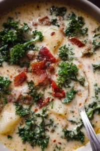 Bowl of creamy Zuppa Toscana soup with kale, sausage, and potatoes