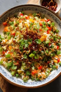 Fresh and colorful Crispy Rice Salad with vegetables and dressing
