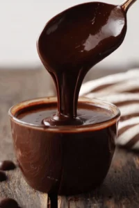 Delicious easy chocolate ganache poured over a dessert