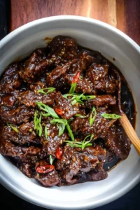 Delicious Slow Cooker Mongolian Beef served with vegetables over rice