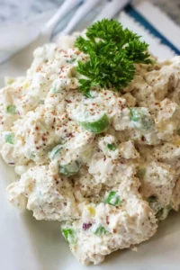 Delicious homemade chicken salad served in a bowl with fresh ingredients
