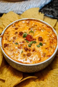 Delicious Chili Cheese Dip served in a bowl with tortilla chips