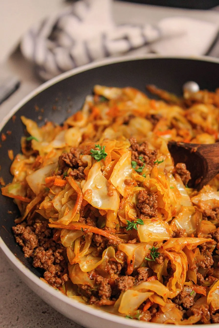 Savory ground beef and cabbage dish served on a plate.