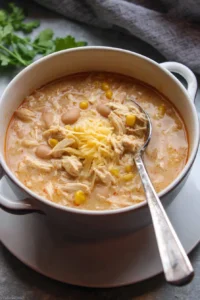 Bowl of White Chicken Chili topped with cilantro and jalapeños