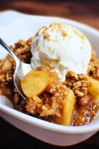 Delicious homemade Caramel Apple Crisp with caramel drizzle and crumble topping