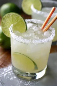 Homemade classic margarita with lime and salt on the rim in a glass