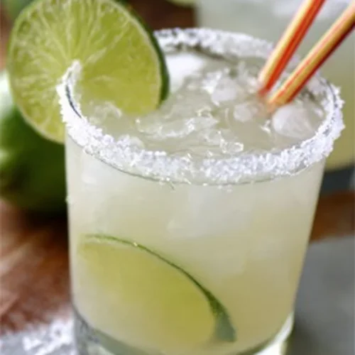Homemade classic margarita with lime and salt on the rim in a glass