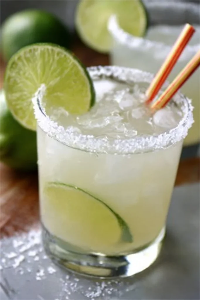 Homemade classic margarita with lime and salt on the rim in a glass