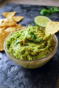 Fresh avocados and ingredients for the world's best guacamole recipe