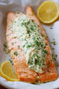 Delicious baked salmon fillet topped with garlic mayo sauce