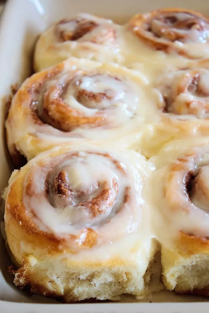 Freshly baked old fashioned cinnamon rolls on a wooden table