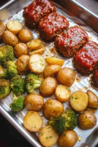Sheet pan mini meatloaf served with roasted potatoes for a quick meal
