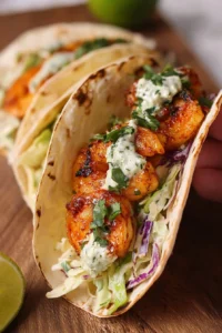 Cilantro lime shrimp tacos served with creamy slaw on a plate