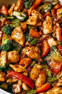 Delicious chicken stir-fry with colorful vegetables in a pan